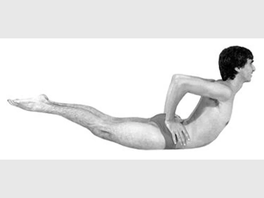 Bow Pose Prep (Dhanurasana Prep) — photograph